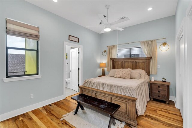 1039 Verret St, New Orleans, LA 70114 - bedroom featuring light wood-type flooring, baseboards, ensuite bath, a ceiling fan, and recessed lighting