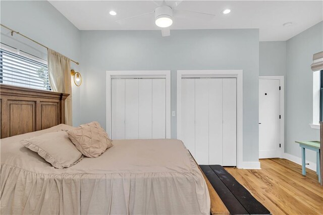 1039 Verret St, New Orleans, LA 70114 - bedroom with two closets, wood finished floors, baseboards, a ceiling fan, and recessed lighting