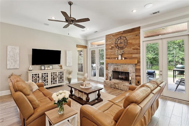 596 Blue Heron Ln, Madisonville, LA 70447 - living area featuring french doors, ceiling fan, ornamental molding, baseboards, and recessed lighting