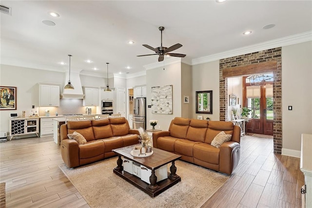 596 Blue Heron Ln, Madisonville, LA 70447 - living area with ceiling fan, light wood-type flooring, recessed lighting, baseboards, and crown molding
