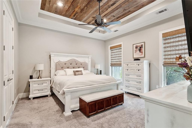 596 Blue Heron Ln, Madisonville, LA 70447 - bedroom featuring a tray ceiling, wooden ceiling, crown molding, light colored carpet, and multiple windows