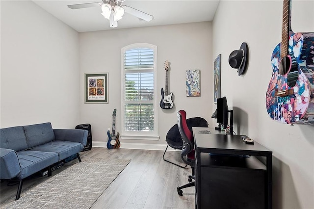 596 Blue Heron Ln, Madisonville, LA 70447 - office area featuring a ceiling fan, wood finished floors, and baseboards