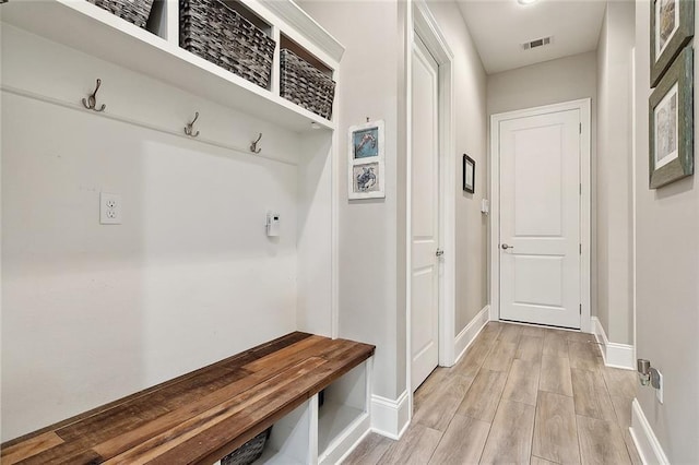 596 Blue Heron Ln, Madisonville, LA 70447 - mudroom with baseboards and light wood-style floors