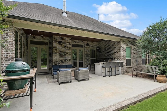 596 Blue Heron Ln, Madisonville, LA 70447 - view of patio with french doors and an outdoor living space
