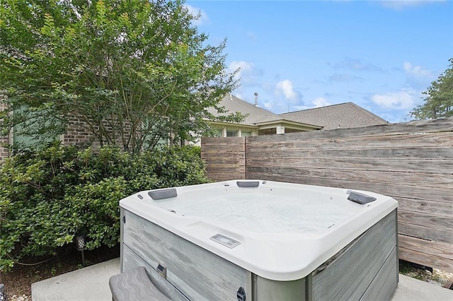 596 Blue Heron Ln, Madisonville, LA 70447 - view of patio featuring a hot tub