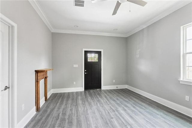 1827-29 Frenchmen St, New Orleans, LA 70116 - foyer featuring a ceiling fan, wood finished floors, crown molding, and baseboards