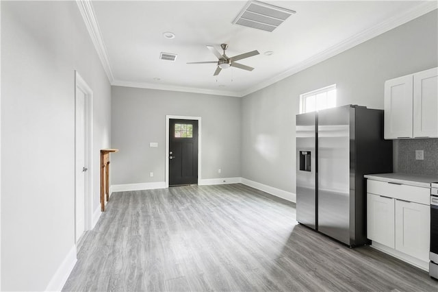 1827-29 Frenchmen St, New Orleans, LA 70116 - kitchen with stainless steel refrigerator with ice dispenser, ceiling fan, plenty of natural light, light wood-style floors, and crown molding