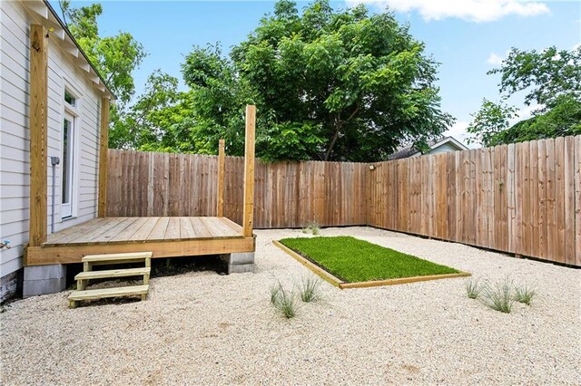1827-29 Frenchmen St, New Orleans, LA 70116 - fenced backyard with a deck