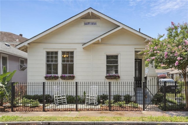 4198 Dumaine St, New Orleans, LA 70119 - bungalow-style house with a fenced front yard