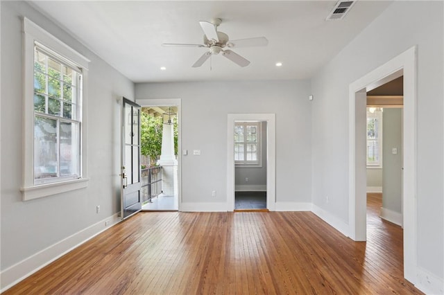4198 Dumaine St, New Orleans, LA 70119 - empty room with plenty of natural light, hardwood / wood-style floors, ceiling fan, baseboards, and recessed lighting