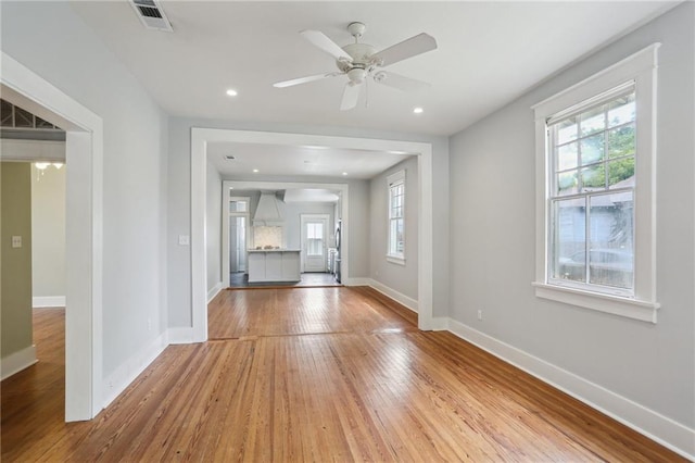4198 Dumaine St, New Orleans, LA 70119 - unfurnished living room featuring baseboards, hardwood / wood-style flooring, ceiling fan, and recessed lighting