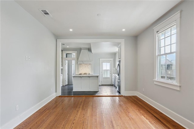 4198 Dumaine St, New Orleans, LA 70119 - unfurnished living room with baseboards, wood finished floors, and recessed lighting