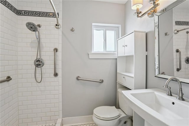 4198 Dumaine St, New Orleans, LA 70119 - bathroom featuring tiled shower, toilet, and a sink