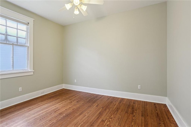 4198 Dumaine St, New Orleans, LA 70119 - spare room with wood finished floors, plenty of natural light, ceiling fan, and baseboards