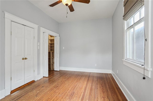 4198 Dumaine St, New Orleans, LA 70119 - unfurnished bedroom featuring wood finished floors, a closet, and ceiling fan