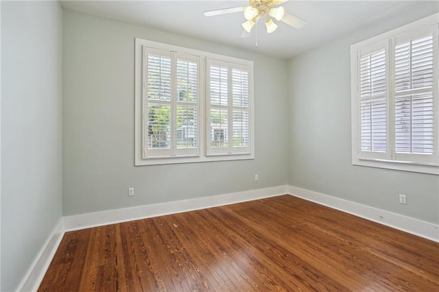 4198 Dumaine St, New Orleans, LA 70119 - spare room with a ceiling fan, dark wood-style floors, and baseboards