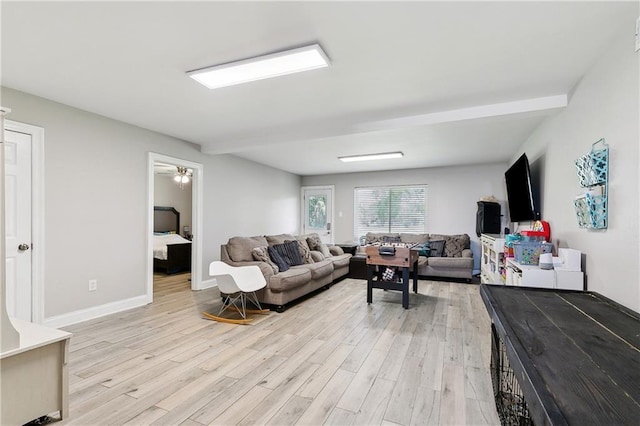 3740 Lake Lynn Dr, Gretna, LA 70056 - living room featuring light wood finished floors, baseboards, and beam ceiling