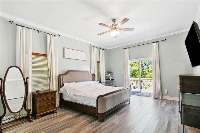 3740 Lake Lynn Dr, Gretna, LA 70056 - bedroom featuring access to outside, ornamental molding, wood finished floors, baseboards, and ceiling fan