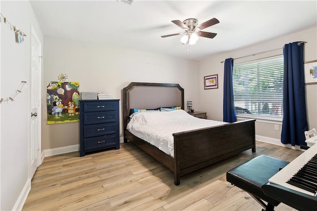 3740 Lake Lynn Dr, Gretna, LA 70056 - bedroom featuring light wood finished floors, baseboards, and ceiling fan