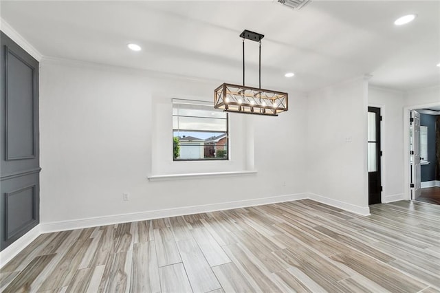 2024 Manson Ave, Metairie, LA 70001 - unfurnished dining area featuring crown molding, a chandelier, baseboards, light wood-type flooring, and recessed lighting