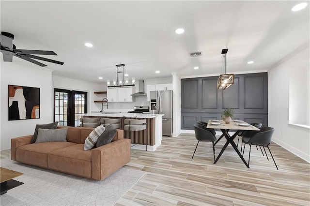 2024 Manson Ave, Metairie, LA 70001 - living area featuring recessed lighting, light wood-type flooring, and crown molding