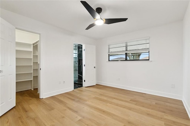 2024 Manson Ave, Metairie, LA 70001 - unfurnished bedroom with a spacious closet, baseboards, light wood-style floors, and a closet