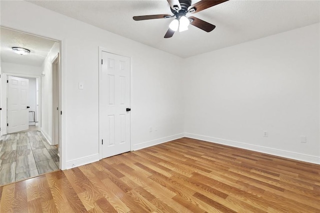 2024 Manson Ave, Metairie, LA 70001 - unfurnished room featuring light wood-type flooring, a ceiling fan, and baseboards
