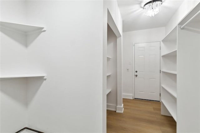 2024 Manson Ave, Metairie, LA 70001 - walk in closet with wood finished floors