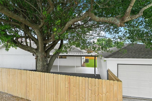 2024 Manson Ave, Metairie, LA 70001 - view of side of home featuring a garage and roof with shingles