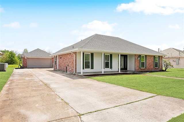255 Wilson Ln, Belle Chasse, LA 70037 - view of front of property featuring brick siding, a garage, a front lawn, a porch, and a shingled roof