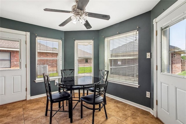 255 Wilson Ln, Belle Chasse, LA 70037 - dining room featuring baseboards, a ceiling fan, and tile patterned flooring