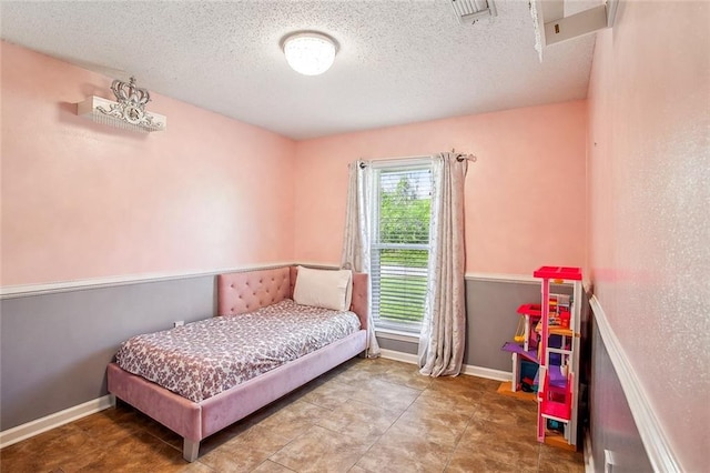 255 Wilson Ln, Belle Chasse, LA 70037 - bedroom with a textured ceiling and baseboards