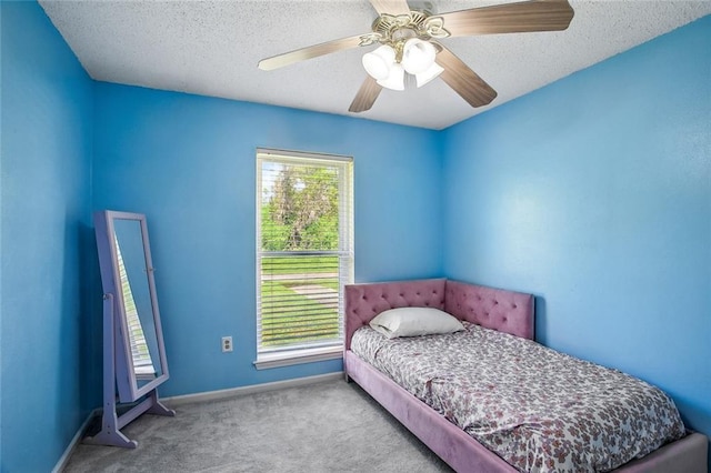 255 Wilson Ln, Belle Chasse, LA 70037 - bedroom with carpet floors, a ceiling fan, baseboards, and a textured ceiling