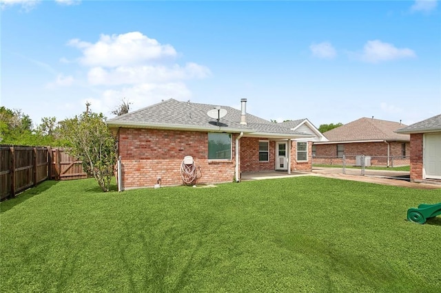 255 Wilson Ln, Belle Chasse, LA 70037 - back of property featuring a patio, brick siding, a gate, and roof with shingles