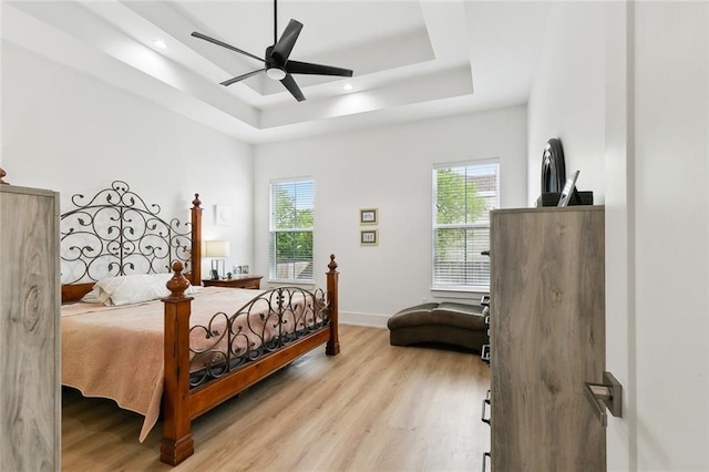 2535 Athis St, New Orleans, LA 70122 - bedroom with a raised ceiling, multiple windows, wood finished floors, and recessed lighting