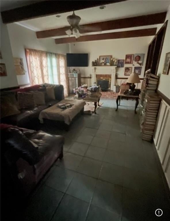 3867 N Teak Ave, New Orleans, LA 70131 - living room featuring a ceiling fan, beamed ceiling, and a brick fireplace