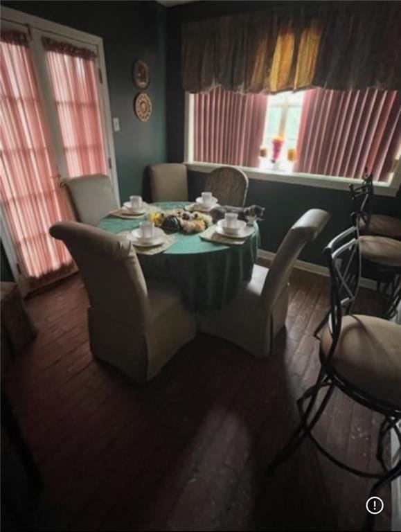 3867 N Teak Ave, New Orleans, LA 70131 - dining space with healthy amount of natural light, dark wood-style floors, and baseboards
