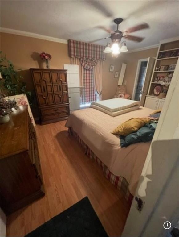 3867 N Teak Ave, New Orleans, LA 70131 - bedroom featuring light wood finished floors, crown molding, and a ceiling fan