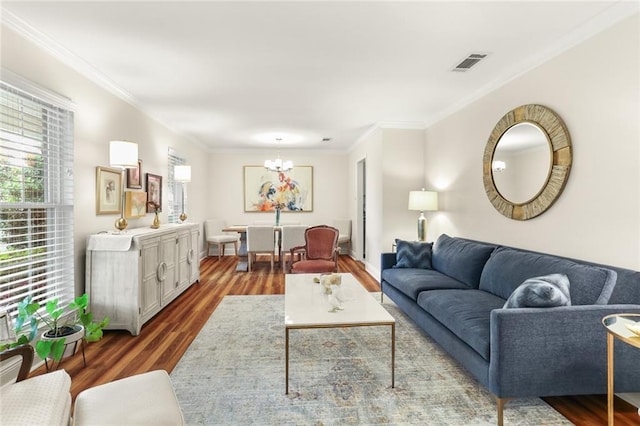 1113 Linwood Ave, Metairie, LA 70003 - living area featuring a chandelier, wood finished floors, crown molding, and baseboards