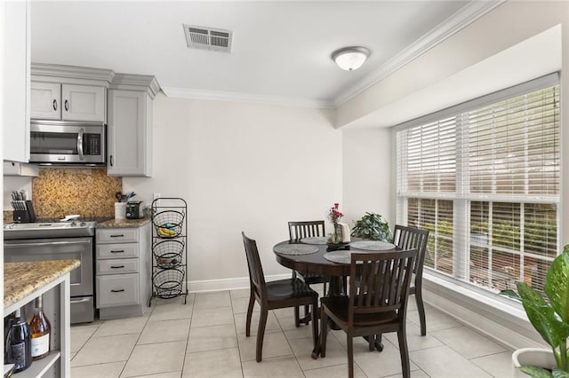 1113 Linwood Ave, Metairie, LA 70003 - dining room with ornamental molding, baseboards, and light tile patterned flooring