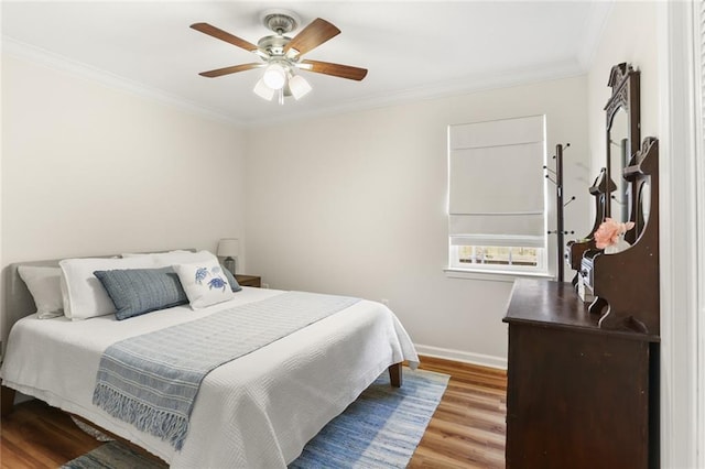 1113 Linwood Ave, Metairie, LA 70003 - bedroom featuring wood finished floors, ornamental molding, baseboards, and a ceiling fan