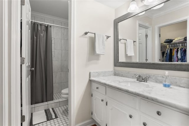 1113 Linwood Ave, Metairie, LA 70003 - bathroom with vanity, toilet, a tile shower, a spacious closet, and ornamental molding