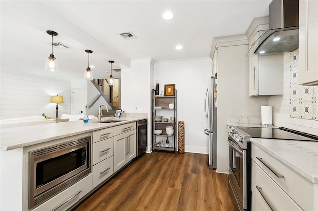 502 Audubon Trce Unit 502, Jefferson, LA 70121 - kitchen featuring a sink, wall chimney exhaust hood, stainless steel appliances, decorative backsplash, and dark wood-style floors