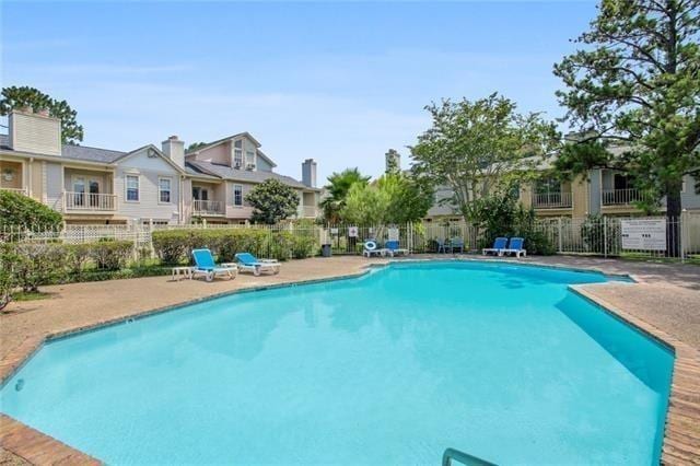 502 Audubon Trce Unit 502, Jefferson, LA 70121 - community pool featuring a patio area