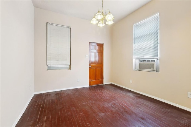 3114 Audubon St, New Orleans, LA 70125 - empty room with cooling unit, a chandelier, wood-type flooring, and baseboards