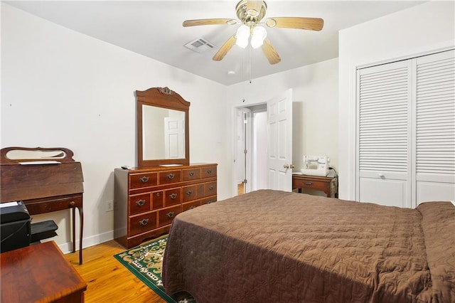 3114 Audubon St, New Orleans, LA 70125 - bedroom featuring a closet, light wood finished floors, baseboards, and ceiling fan