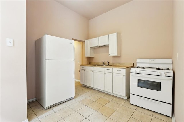 3114 Audubon St, New Orleans, LA 70125 - kitchen with white appliances, a sink, white cabinetry, light tile patterned floors, and light countertops