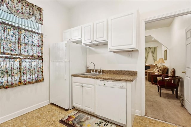 3114 Audubon St, New Orleans, LA 70125 - kitchen with white appliances, white cabinets, and a sink