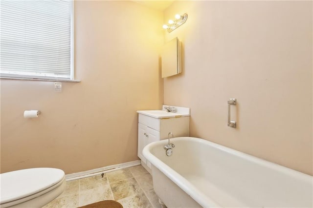 3114 Audubon St, New Orleans, LA 70125 - full bath with a soaking tub, baseboards, vanity, and toilet