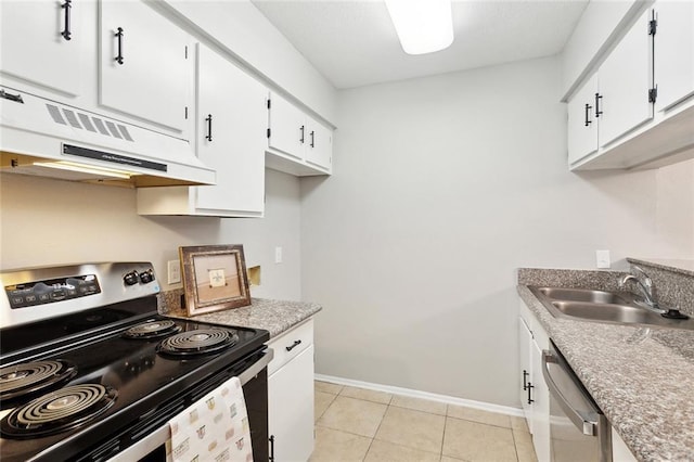 303 Parkview Blvd Unit 303, Mandeville, LA 70471 - kitchen with stainless steel appliances, a sink, baseboards, under cabinet range hood, and white cabinets